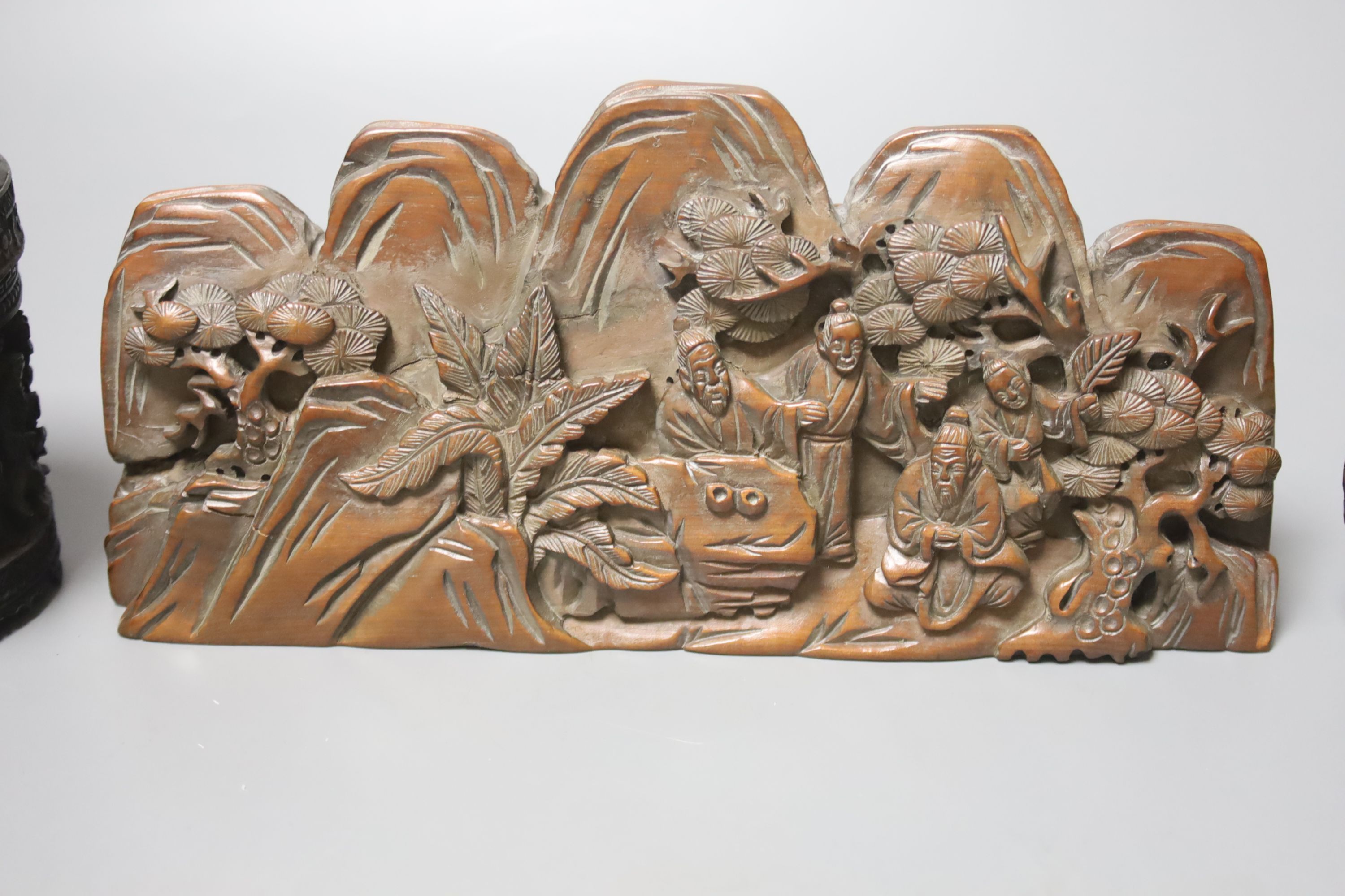 Five Chinese wood carvings including a circular box and a card case, largest 23cm wide